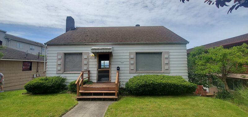 Front exterior alternate view with covered entry and deck