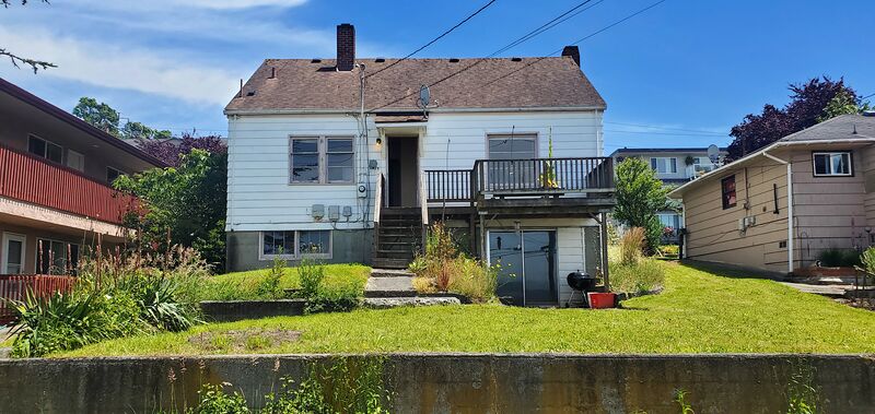 Back of the home showing deck and basement walkout